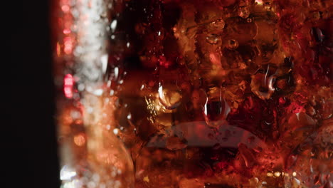 Close-up of a glass of cold soda with ice