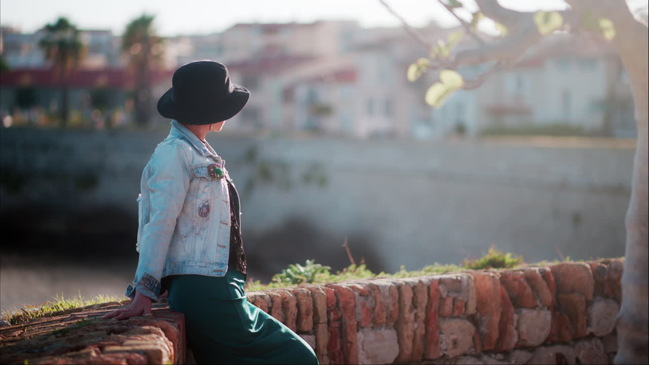 Woman posing at a viewing point of the sea in Antibes, France
