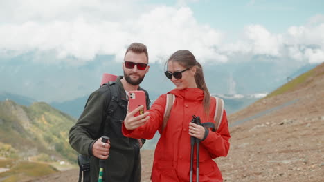 hikers taking a selfie in the mountains