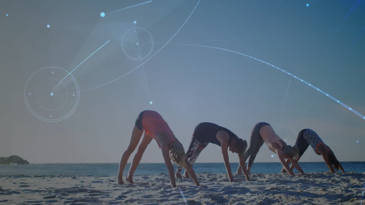 Yoga class on beach with digital network animation overlaying scene