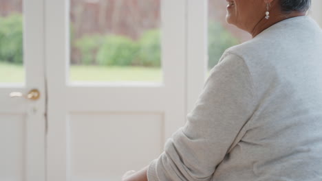 happy girl greeting grandmother with hug granny smiling embracing her granddaughter enjoying hug from grandchild at home family concept 4k