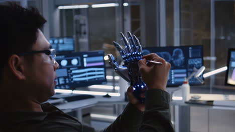 engineer working on a bionic prosthetic hand in a high-tech lab