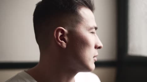 man looking out of a window