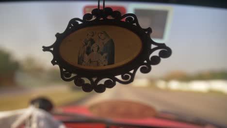 car interior hanging  religious amulette, cuba rack focus