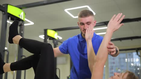 physical therapist assisting patient with exercise