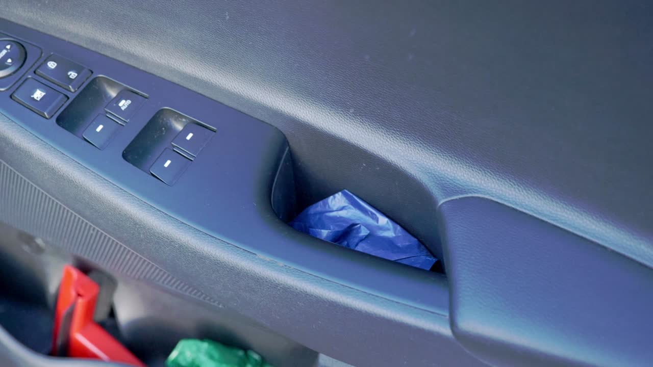 Close up of interior drivers door controls for electric power windows and mirrors