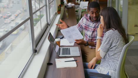 Business-people-working-together-on-a-document-in-office-4k