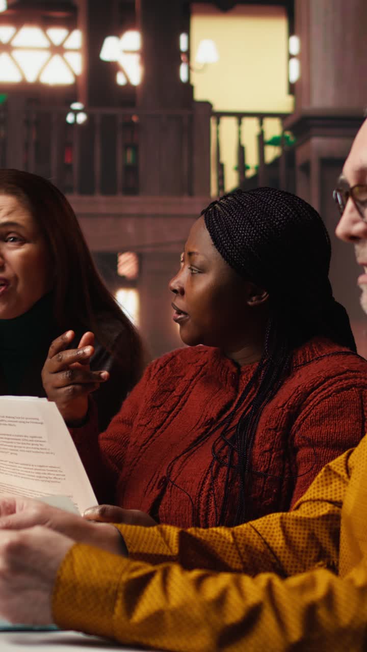 Vertical Video Diverse actors team reading their scripts during theatre drama play rehearsal