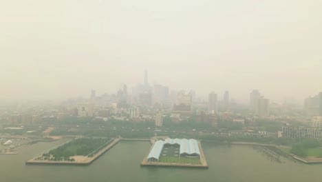 Aerial view of a big city with traffic pollution and smog.