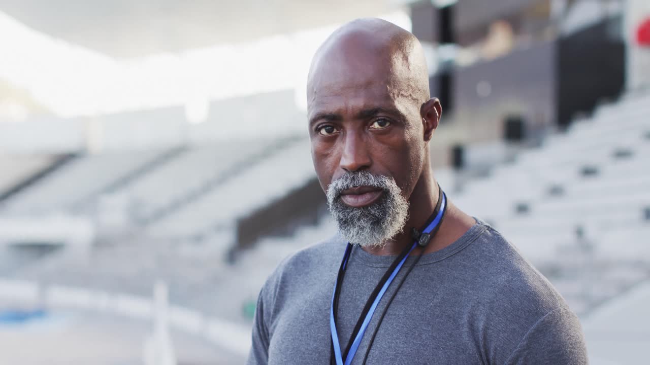Portrait of african american male coach looking at camera and smiling