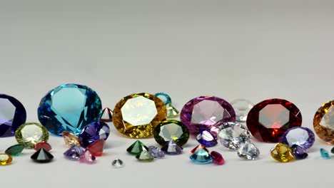 colorful diamonds of various sizes in a white mist.