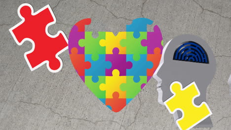 animation of puzzles falling over heart formed with puzzles and human head with maze