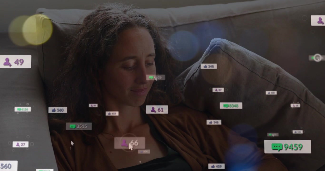 Animation of social media icons and spots of light over caucasian woman using smartphone at home