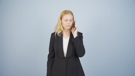 business woman getting interrupted and angry while talking on the phone.