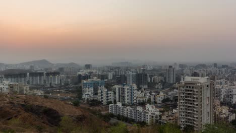 beautiful cityscape and motion controlled panning day to night time lapse of an indian city, india