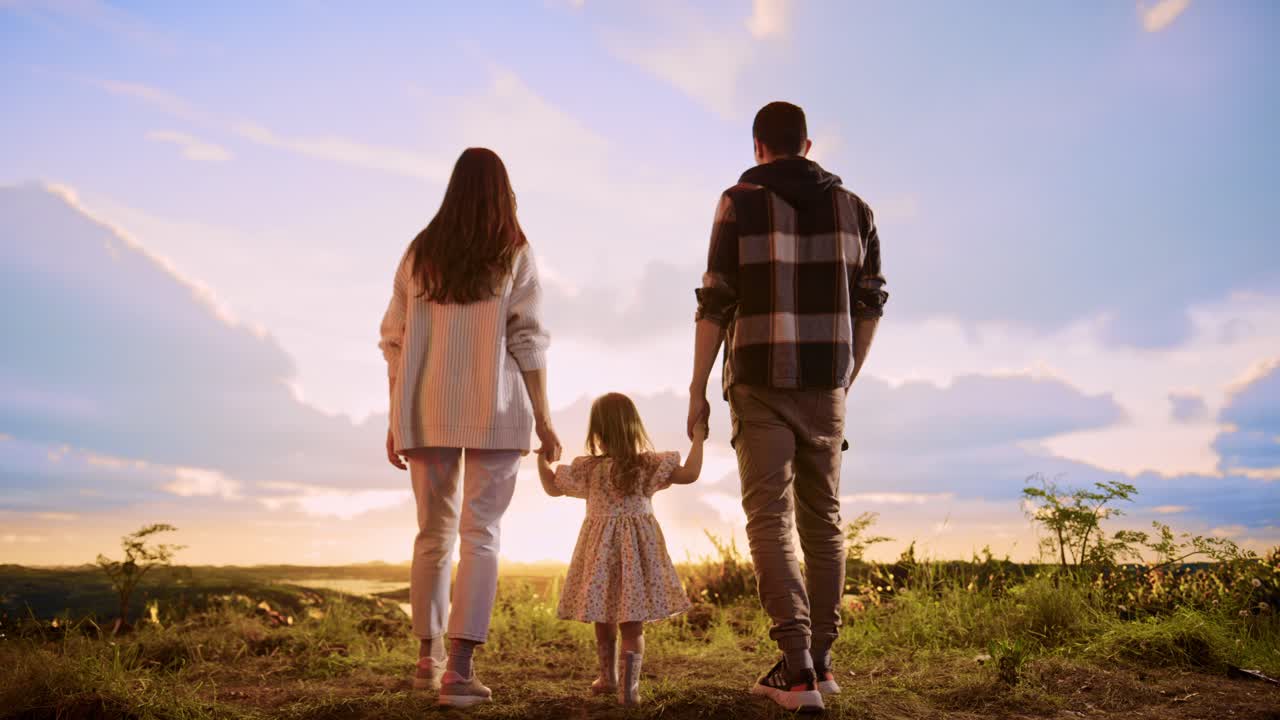 Family enjoying a sunset walk