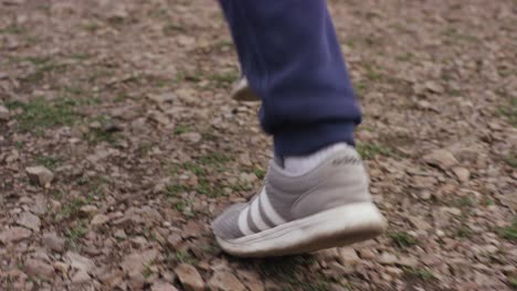 person running on a gravel path