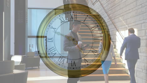 animation of moving clock over asian businessman using smartphone in office