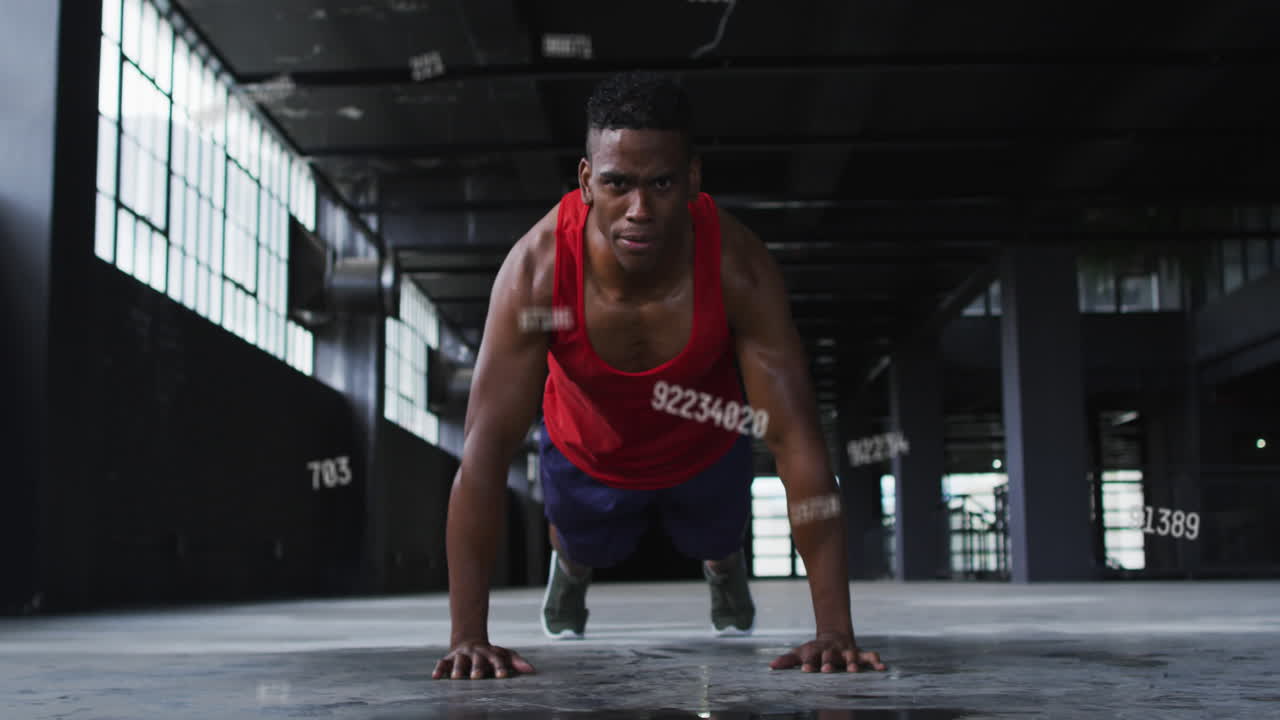 animación de números que caen sobre un hombre haciendo flexiones en un edificio abandonado