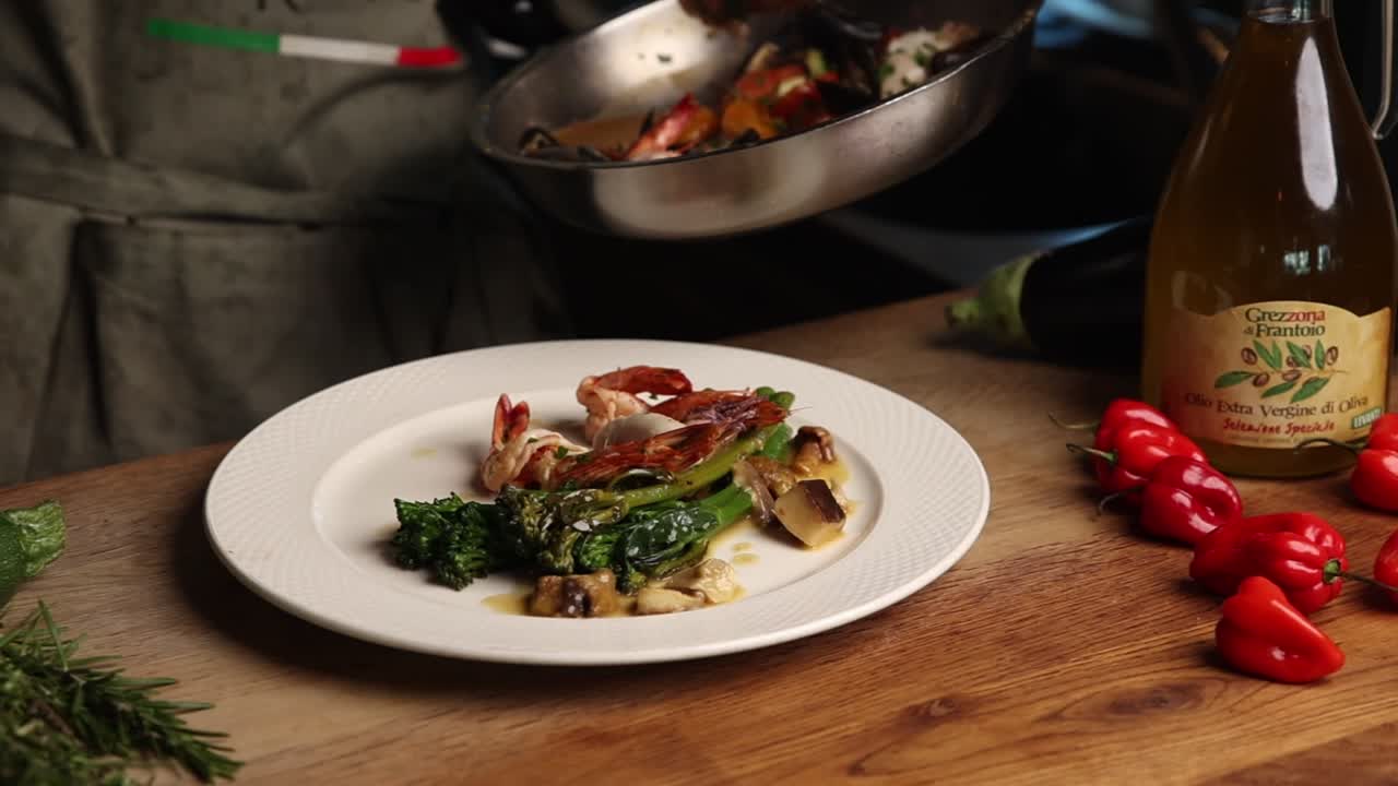 Chef Plating Gourmet Shrimp and Vegetable Dish in Restaurant Kitchen