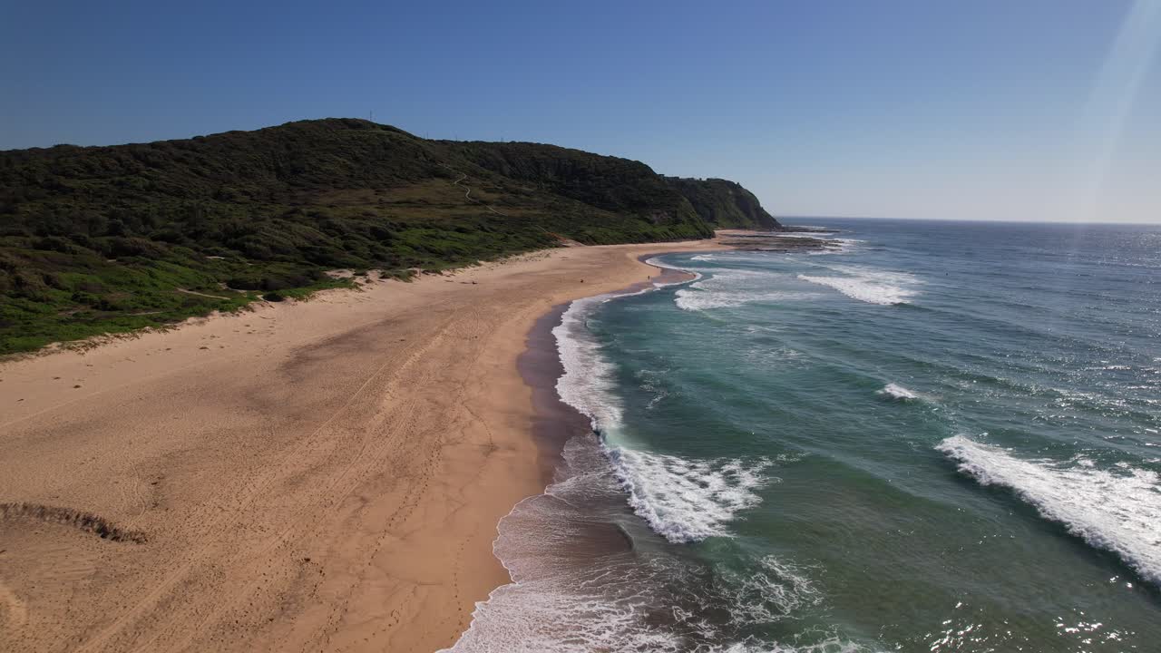 Sea Waves Splashing Sandy Shore Of Glenrock Beach In Merewether, NSW, Australia - Aerial Shot