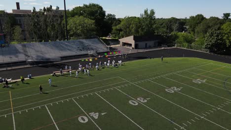 football-school-teams-after-a-match,-aerial-view