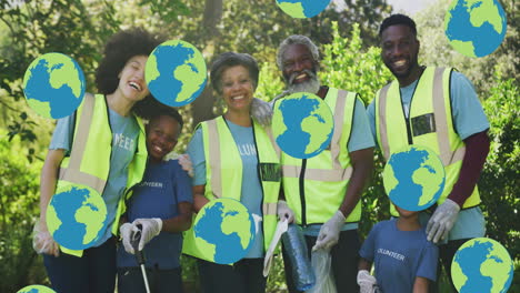 animation of falling globes over happy african american family cleaning up rubbish in countryside