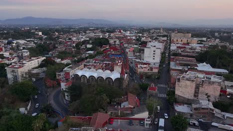 aerial drone orbit of the facade of iglesia del calvario in cuernavaca, morelos, mexico