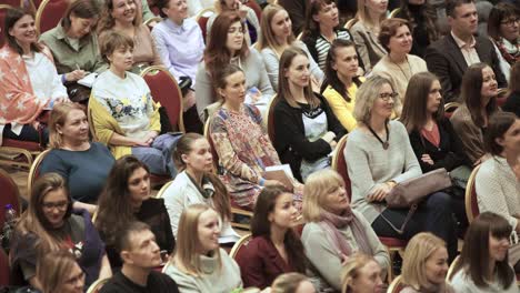 conference attendees in auditorium