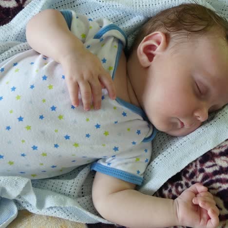 baby and cat daytime sleeping together