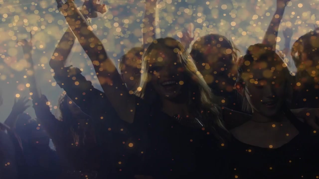 Event crowd raising arms as center leader gesturing, celebrating, golden particles overlaying faces