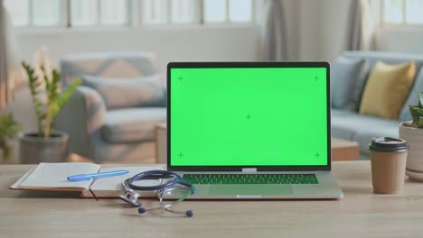 dotor's computer laptop with green screen at medical office, video in 4k