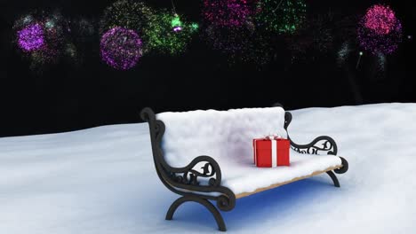 Animation-of-fireworks-exploding-over-christmas-presents-on-bench-with-snow