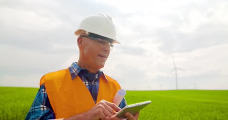 angry engineer talking on mobile phone at farm 5