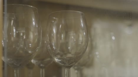 various wine glasses in a cabinet, close up look