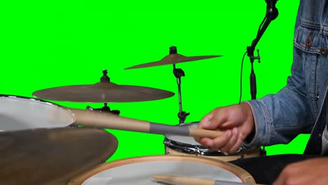 Mid-section-of-drummer-playing-drum