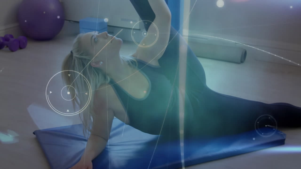 female fitness enthusiast performing side stretch inside studio, overlaying circular UI graphics