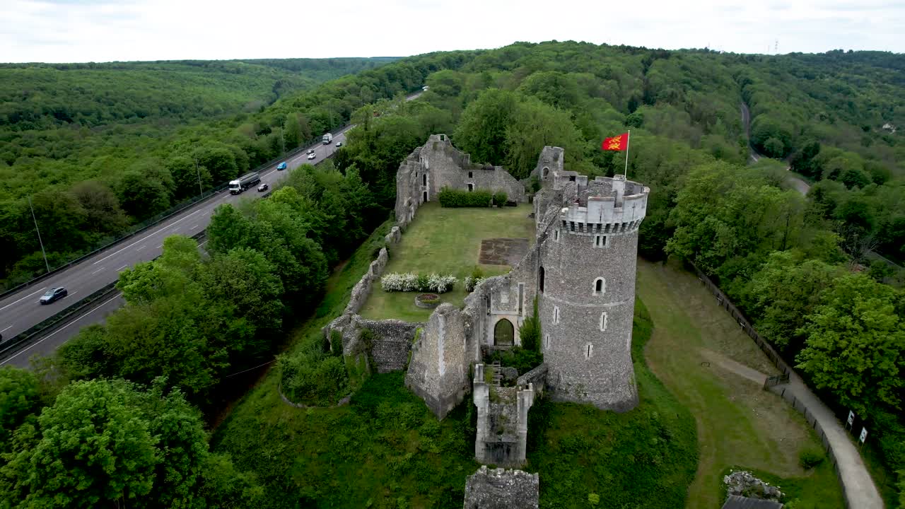 Aerial Panning View of Normandy France Castle in Forest next to freeway