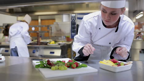 cook choosing fruits for salad