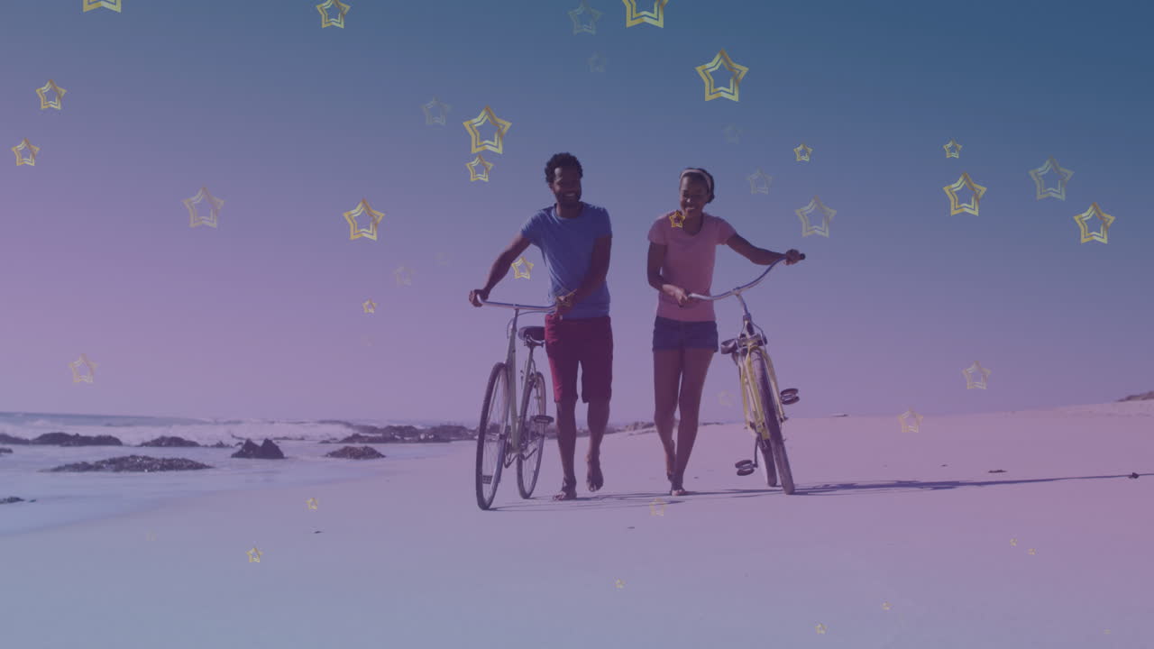 아프리카계 미국인 부부 와 함께 해변 에서 자전거 를 타고  ⁇ 고 있는 골든 스타 아이콘