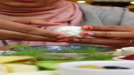 woman peeling a boiled egg