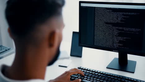 man coding on a computer