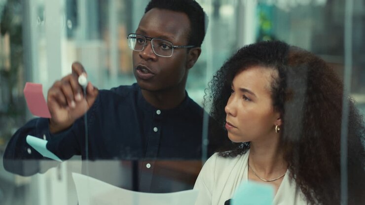 Business people, teamwork and writing on glass