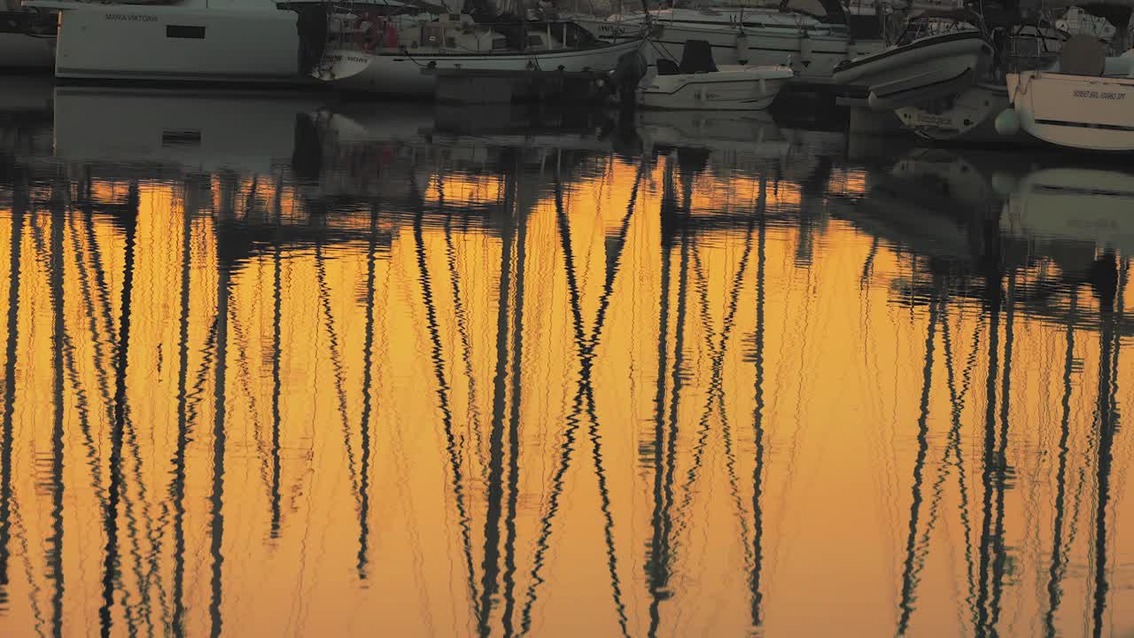 Water reflection at a marina during sunrise