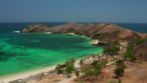 the white sand beach of tanjung aan in lombok, indonesia during a sunny day