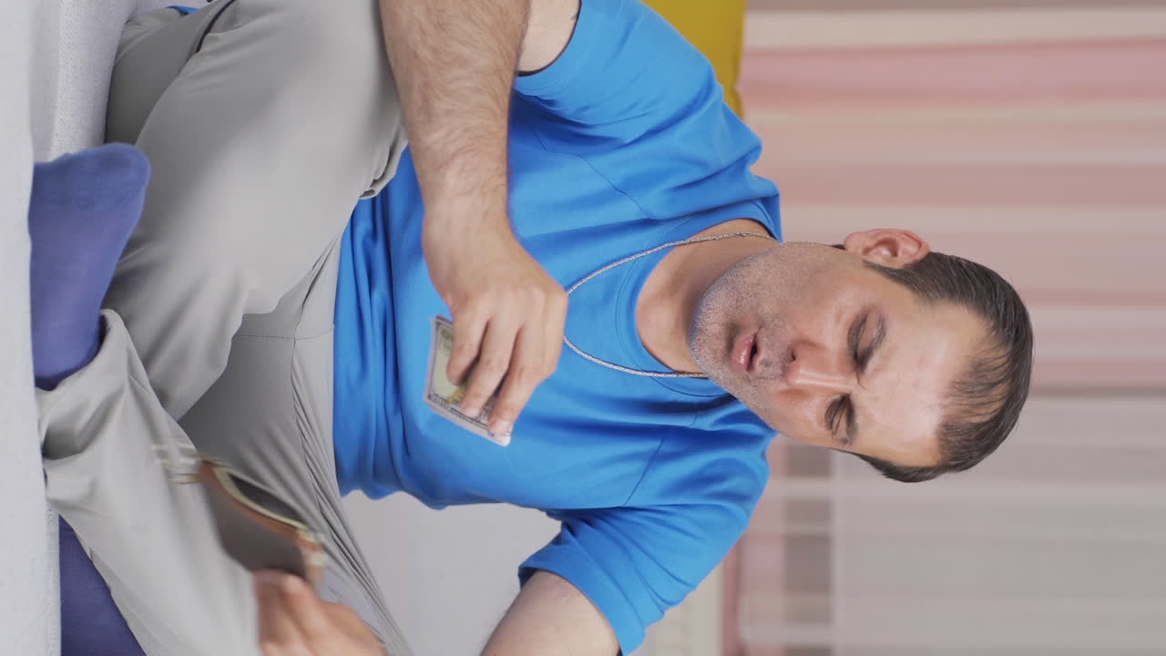 Vertical video of The rich man with money is happy.