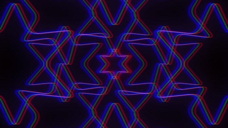 A vibrant and dynamic multicolored zigzag pattern with red, blue, and purple lines set against a dark background. The lines intersect and run in parallel, creating an engaging visual contrast