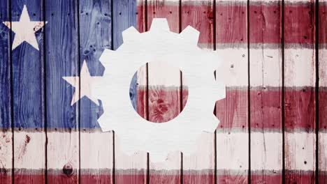 animation of spinning white cog over american flag