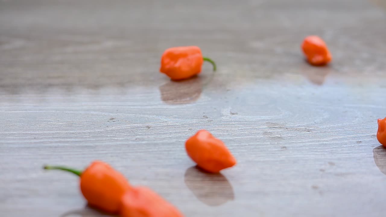 Orange Habanero Peppers on Grey Surface