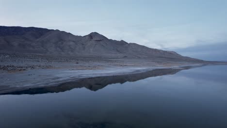 drone fly above sierra nevada lake revealing scenic mountains landscape in california national park , unpolluted planet earth